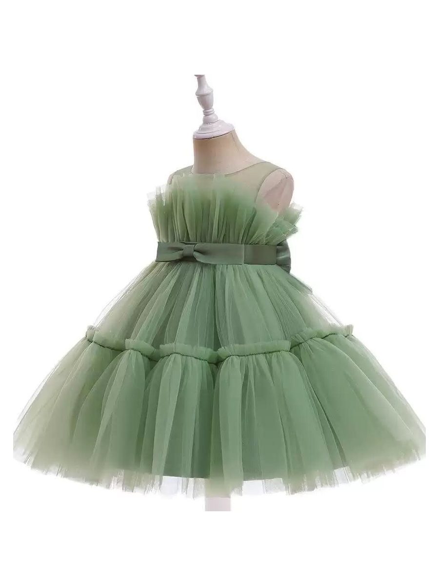 A sage tulle dress, laid flat. Not one of the six named pieces.